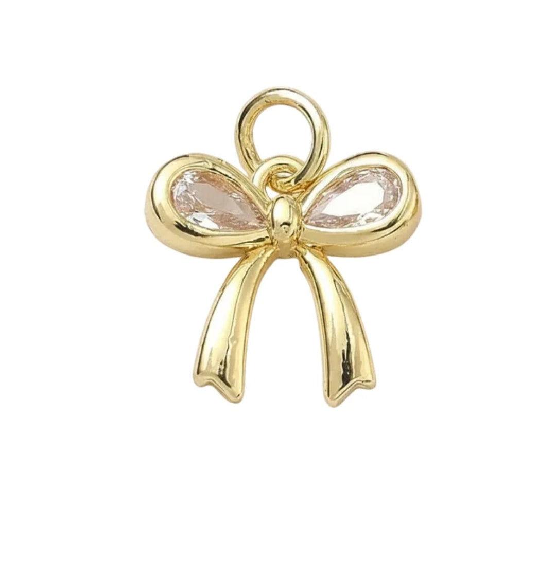 Pendentif breloque noeud zirconiums sertis